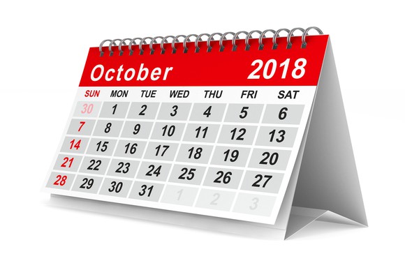 An October 2018 calendar standing on a surface.