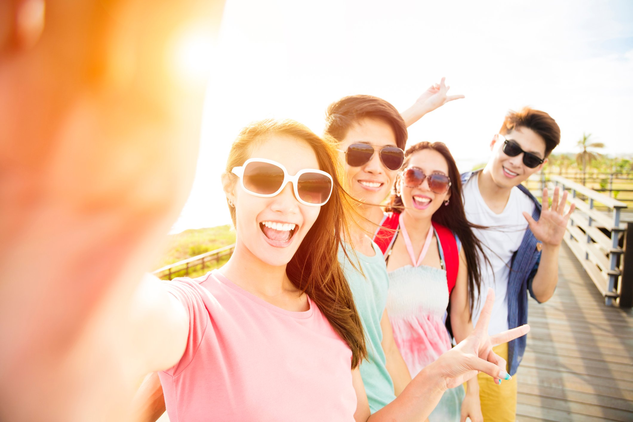 A group of young people take a selfie.