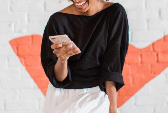 A woman uses Bumble's app.