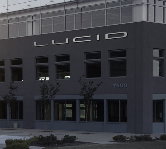 A close-up of the "LUCID" logo on the front of an office building.