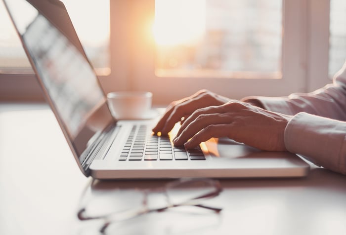 Man typing on laptop