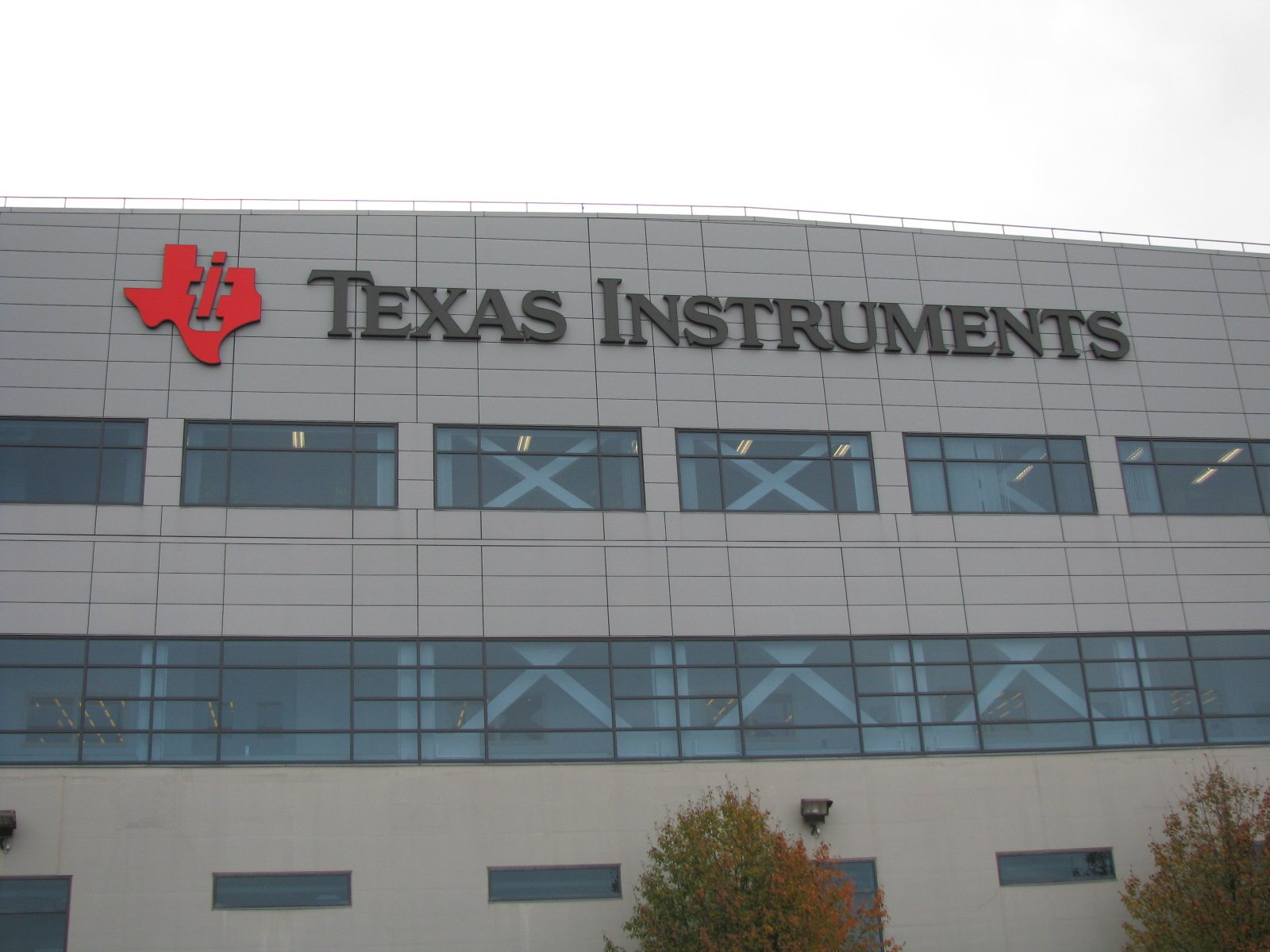 A building with the Texas Instruments corporate logo displayed.