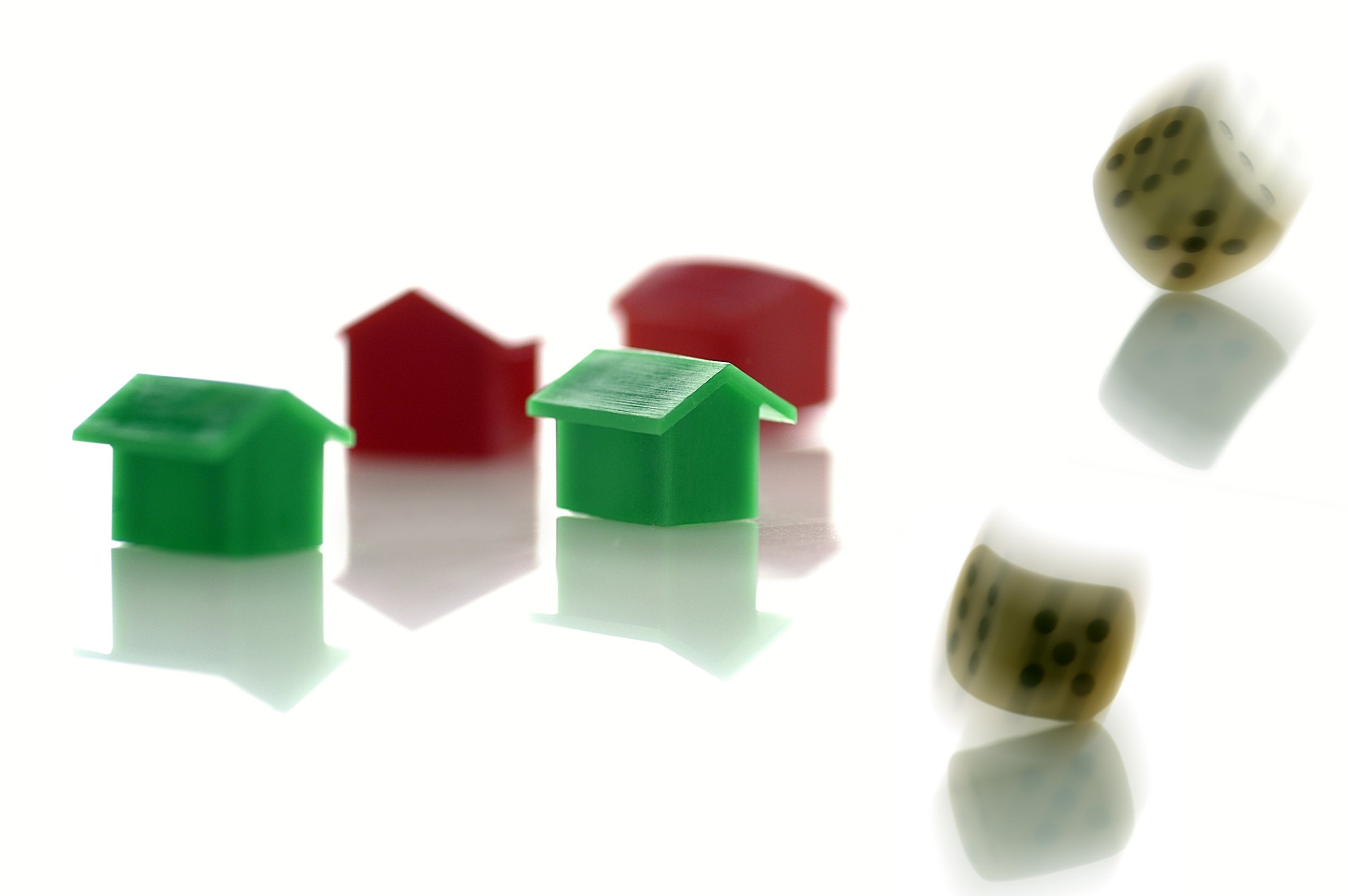 Monopoly board game houses, hotels, and dice