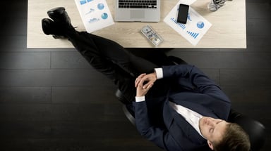 342 businessman feet on desk