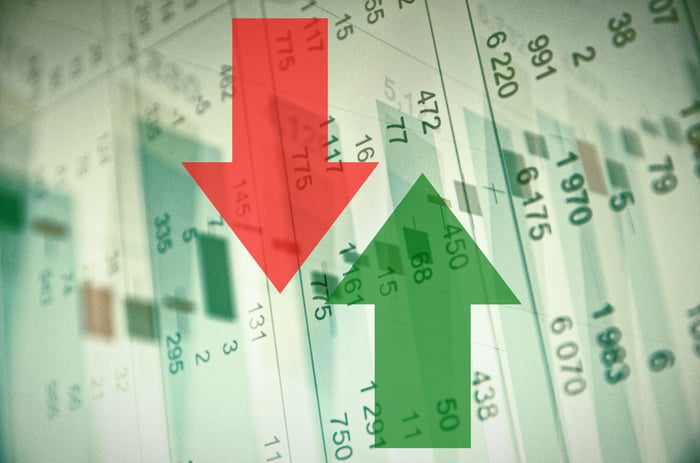 Down and up arrows superimposed on columns of numbers.