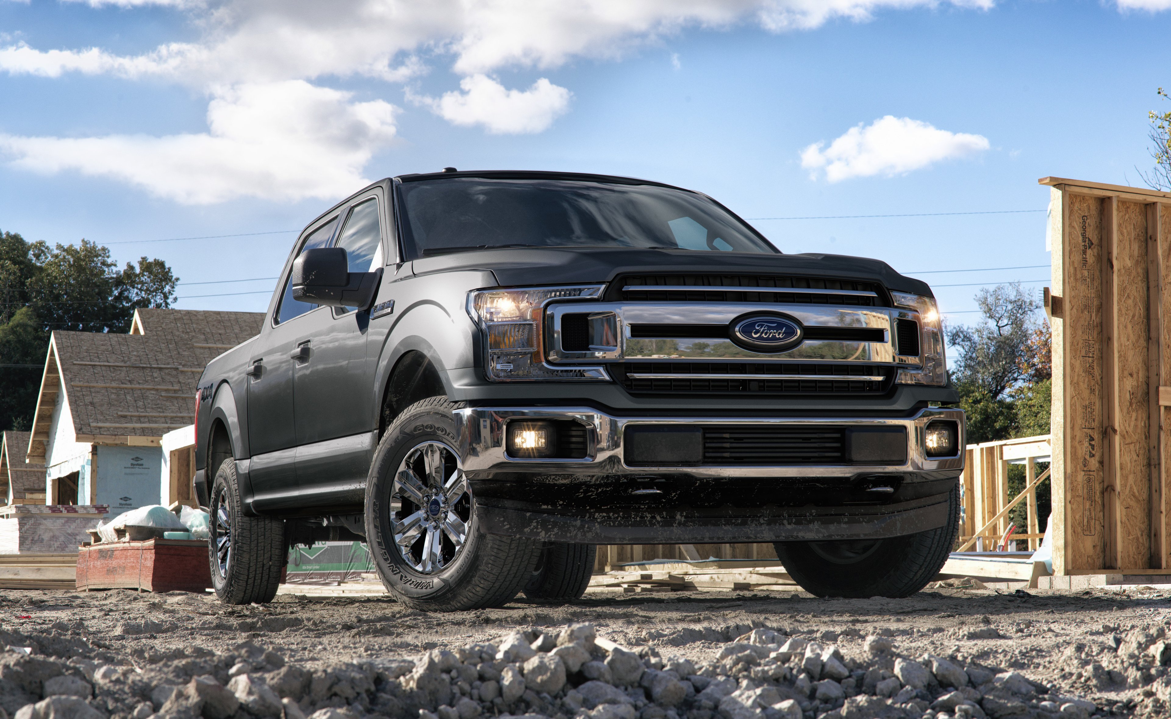 A 2018 Ford F-150 pickup truck on a construction site.