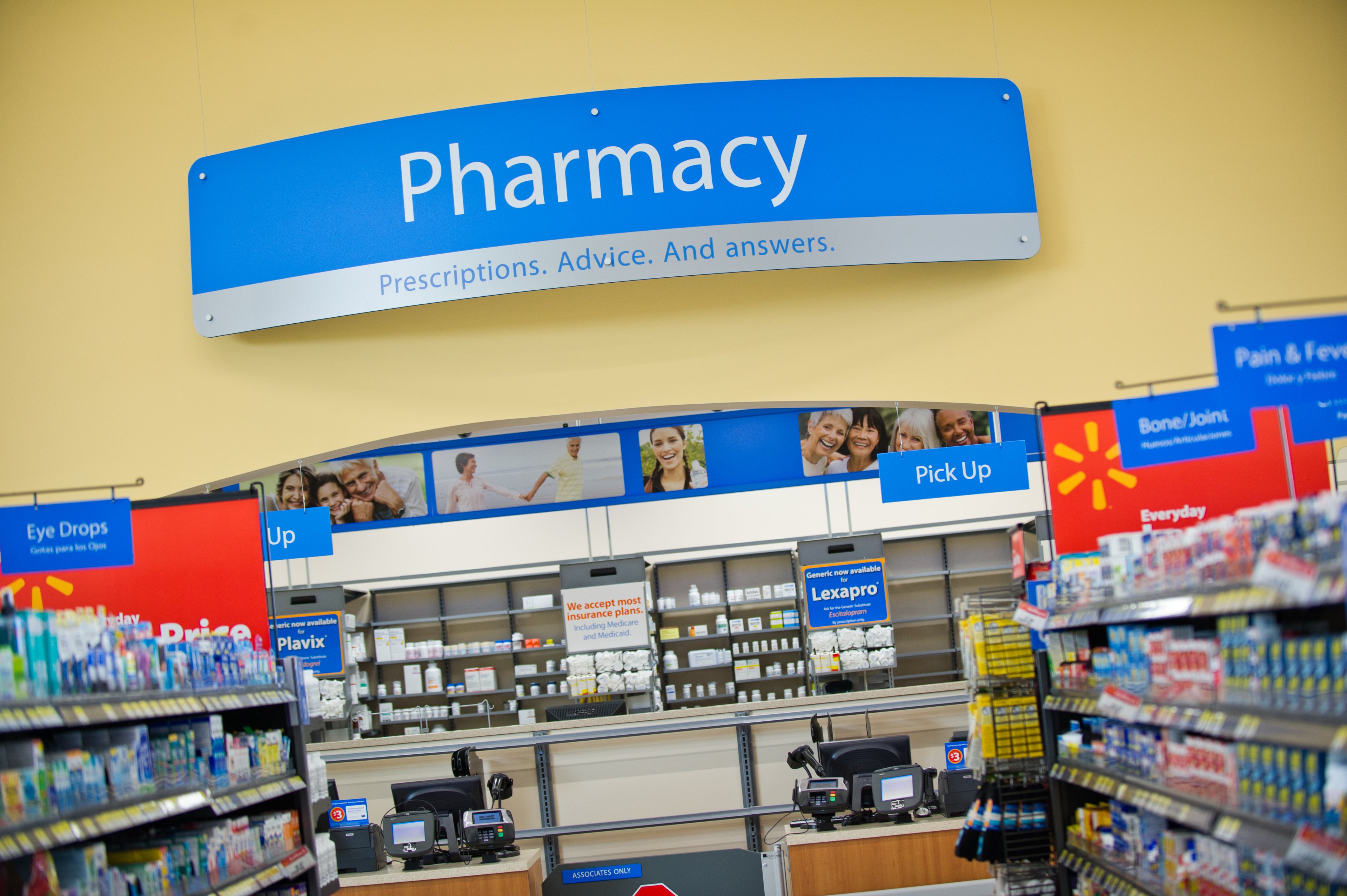 A panorama of Walmart's pharmacy section with pick-up counter. 