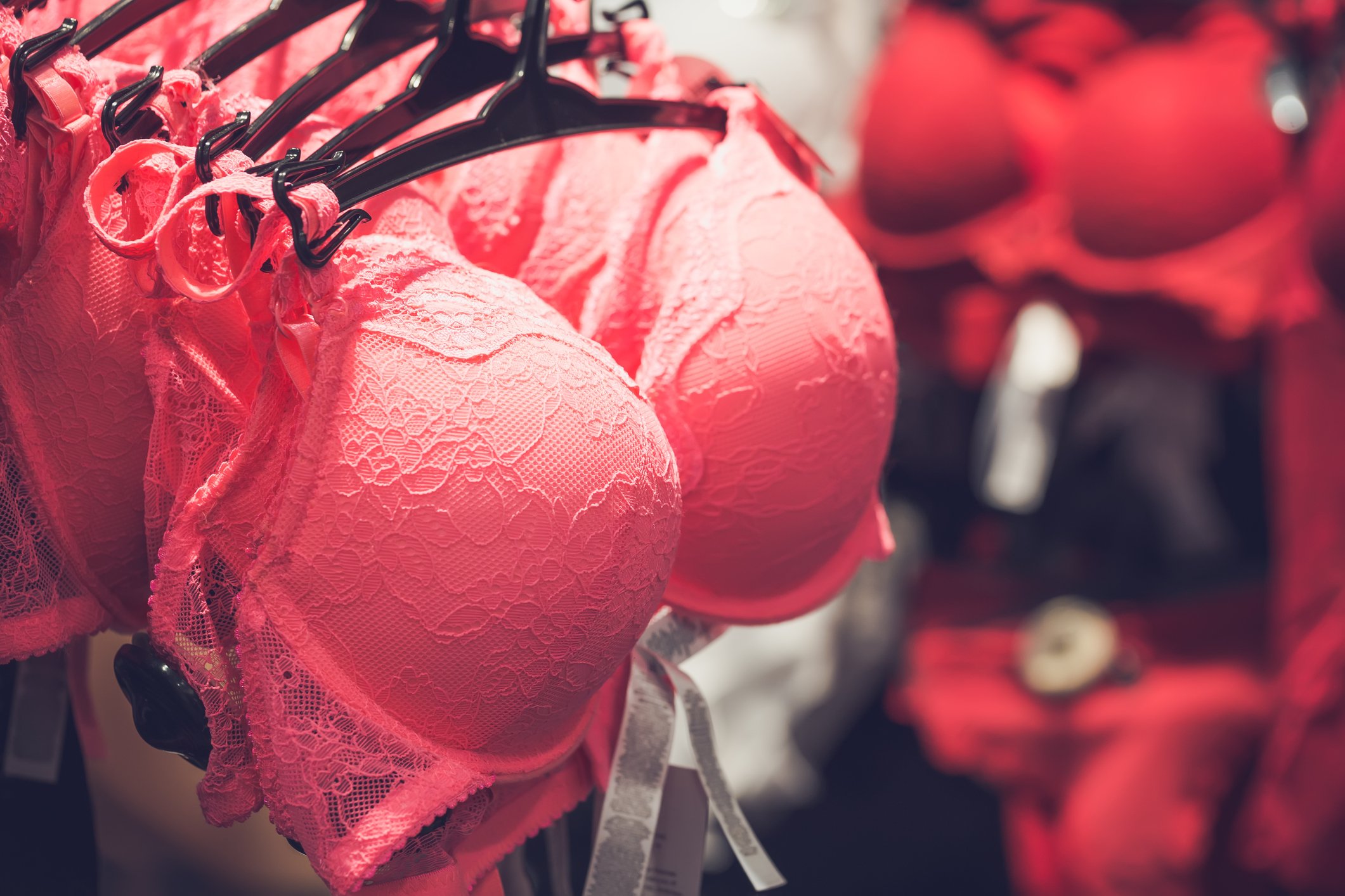 Red bras on a rack.