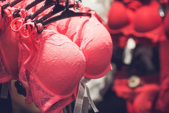 Red bras on a rack.