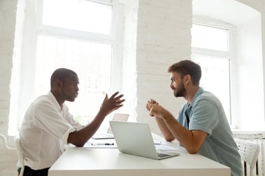 two men talking_GettyImages-916520140
