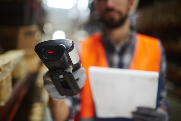 A warehouse worker with a scanner