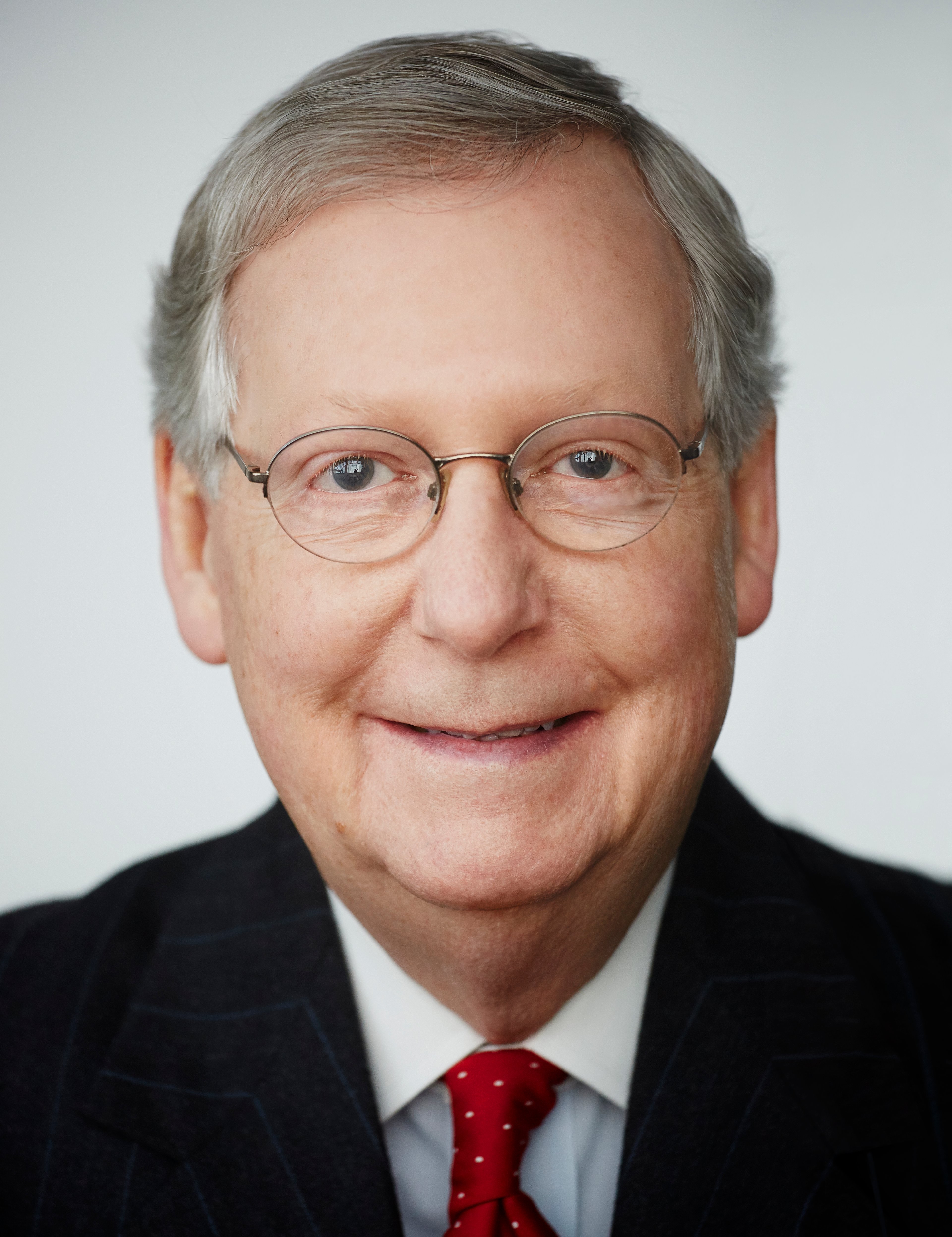 A smiling photo of Kentucky Senator Mitch McConnell. 