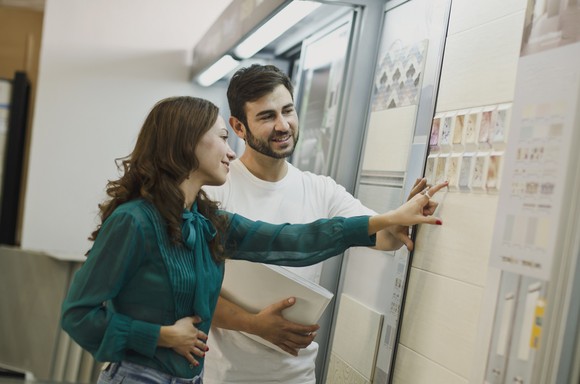 Man and woman shop for tile.