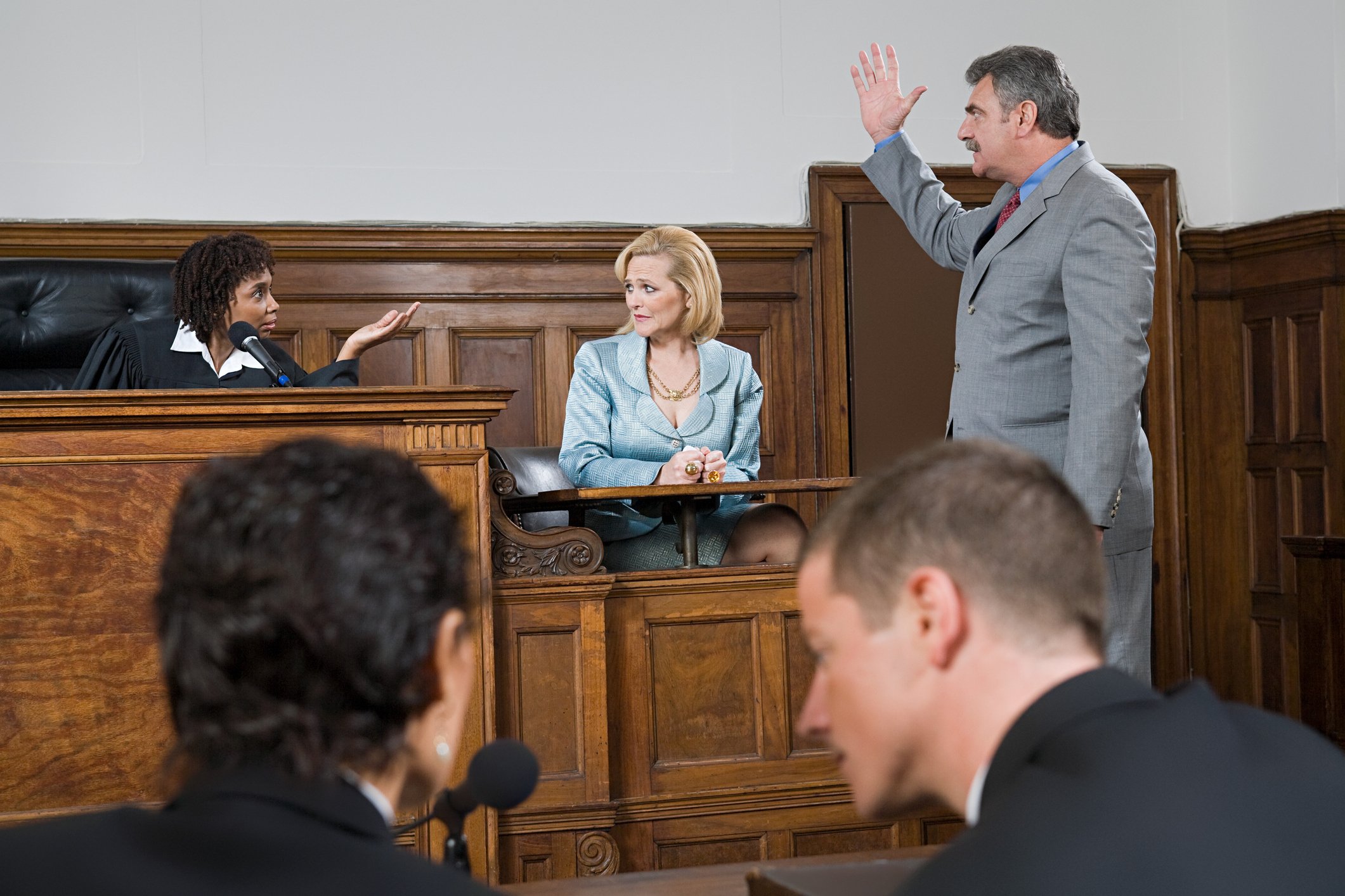 Lawyers arguing in court.