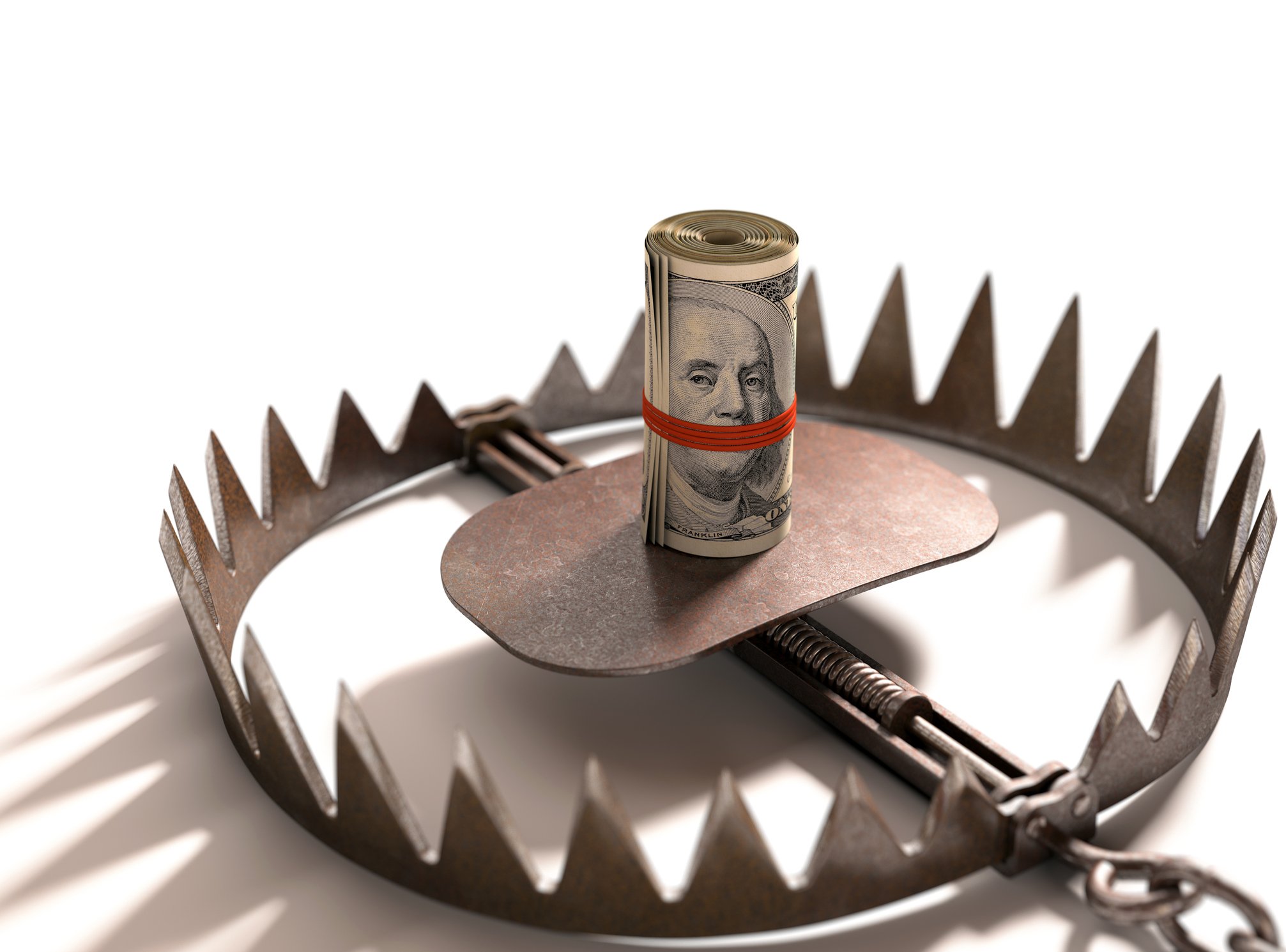 Rolled up wad of money in a bear trap.