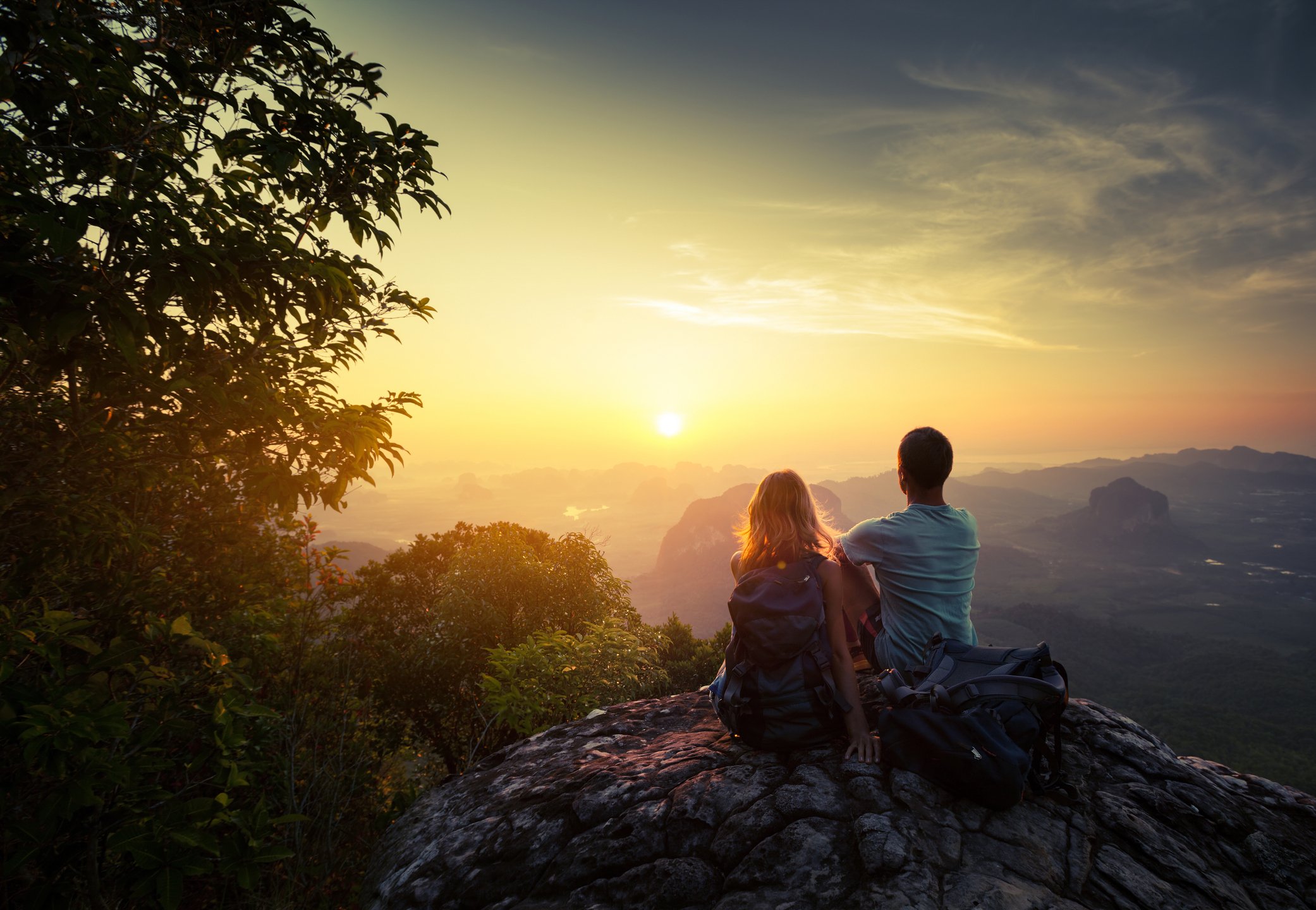 Couple watching sunrise in mountains