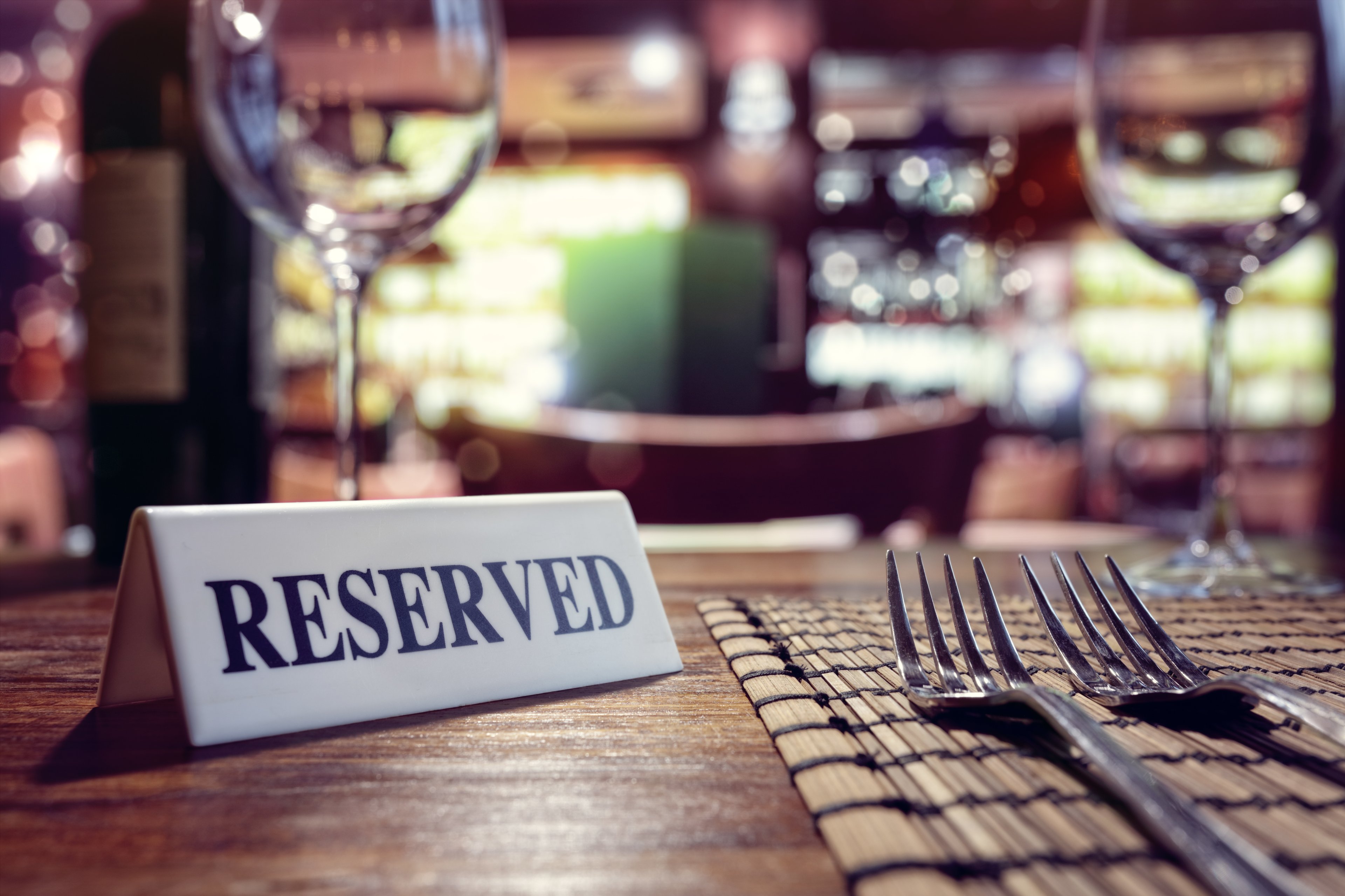 A reserved sign at a restaurant table