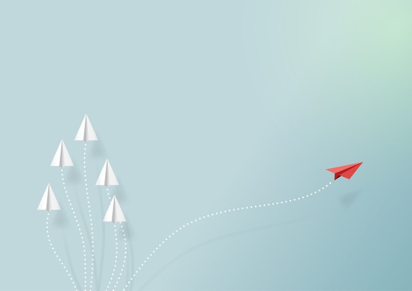 Paper airplanes flying on blue sky and cloud