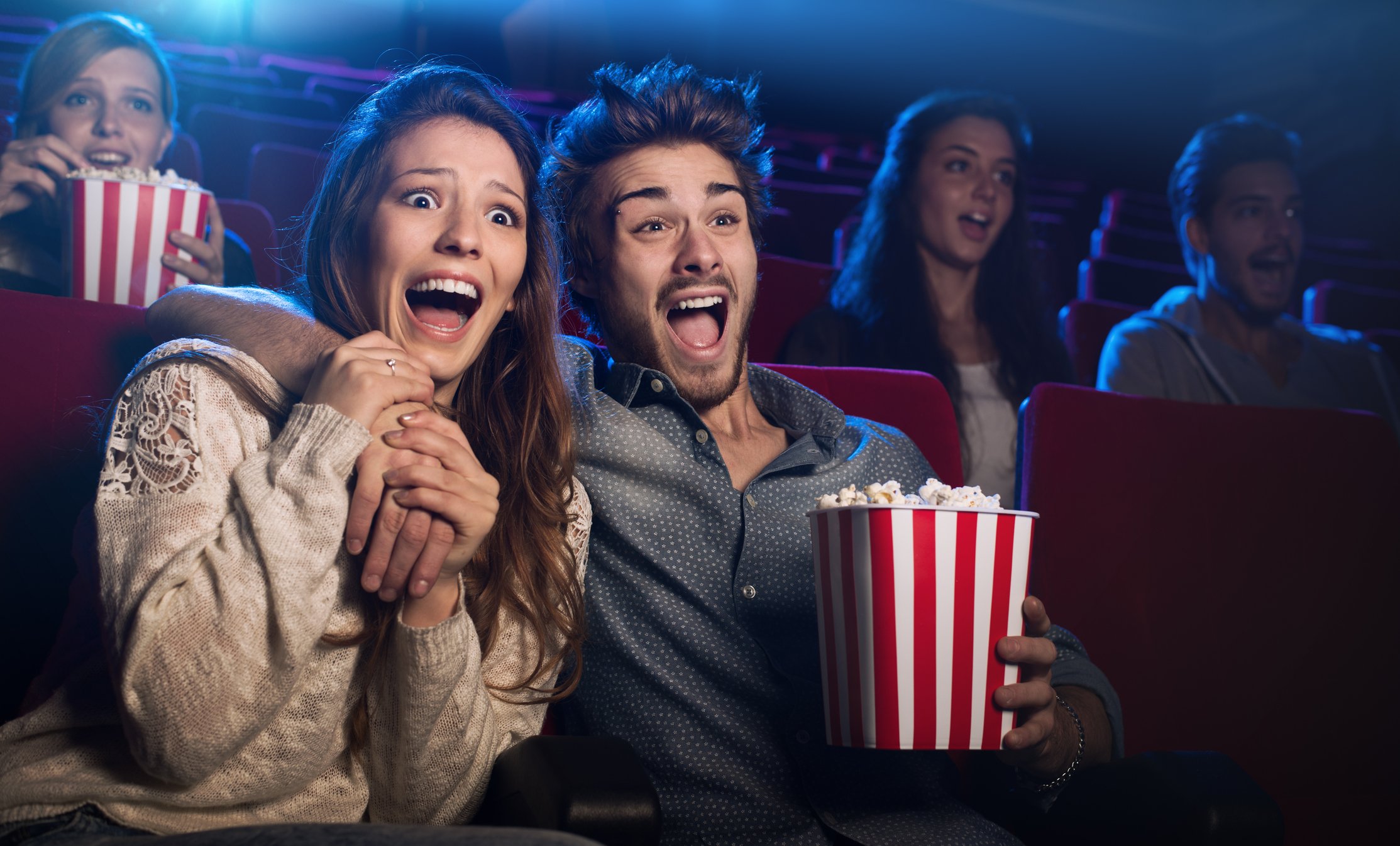 People showing fear at movie theater