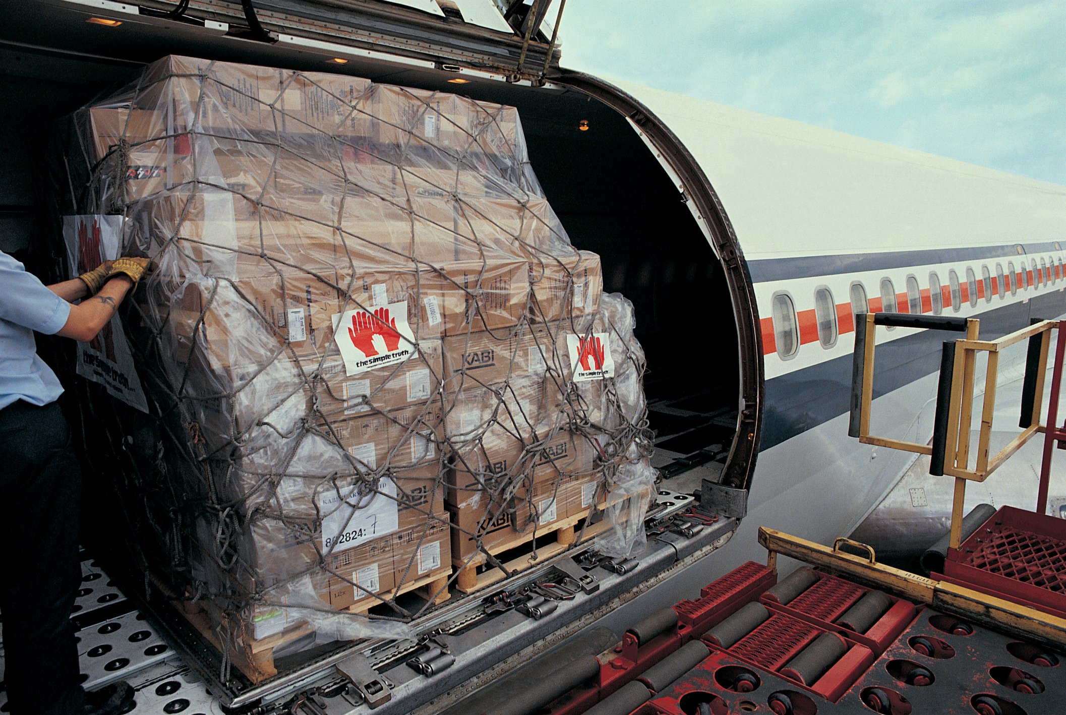 A cargo plane being loaded. 