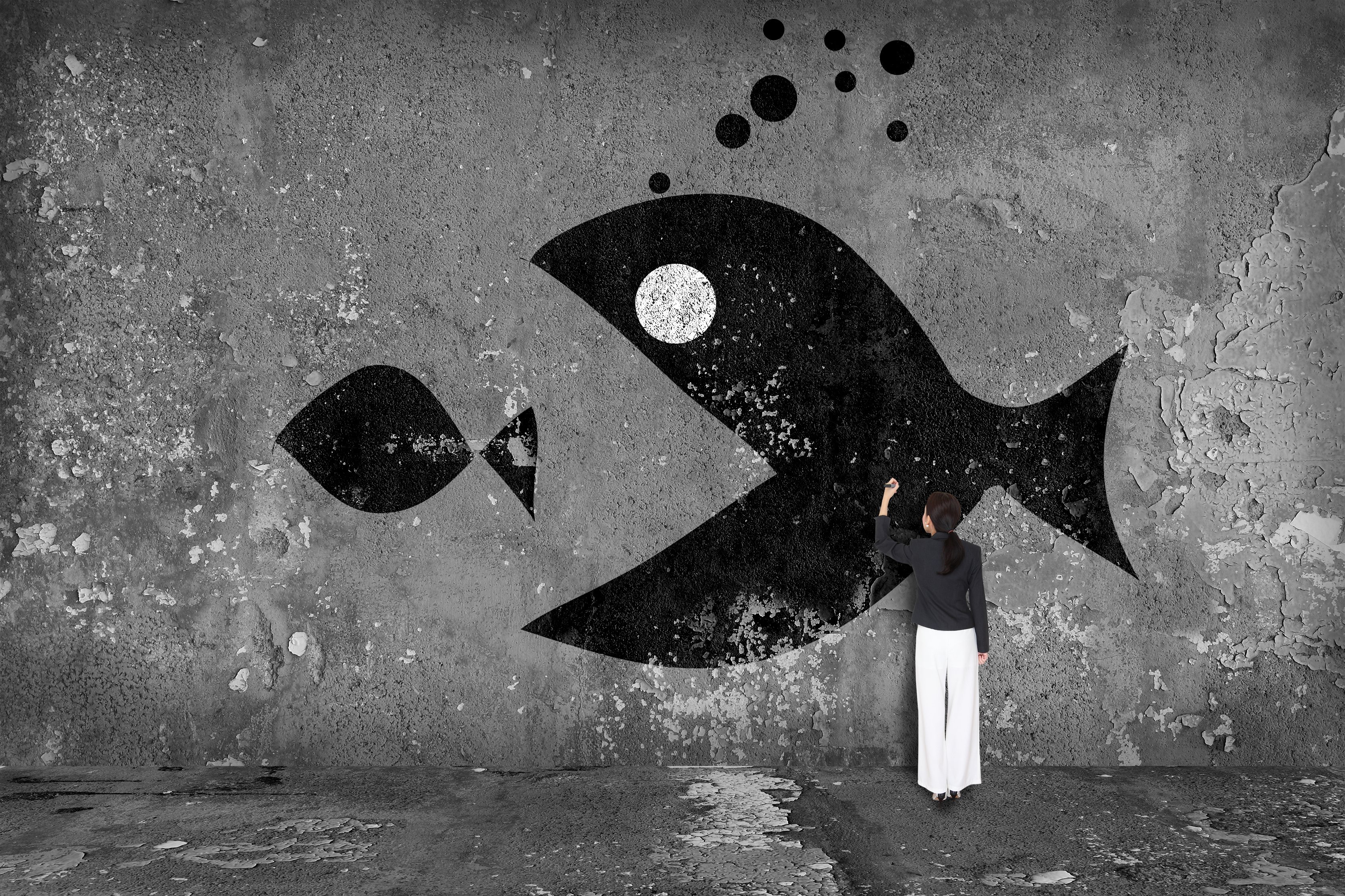 A person painting a picture of a big fish attempting to eat a smaller fish 