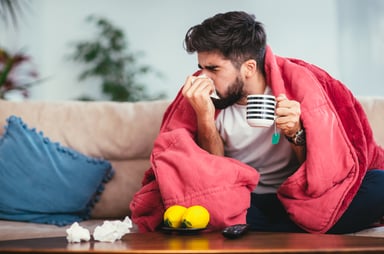 flu man with blanket GettyImages-924698666