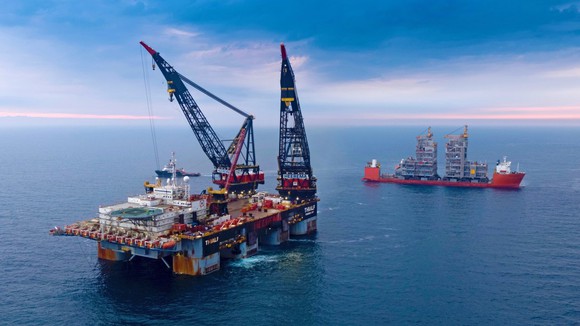 Installing topsides at an offshore oil platform.