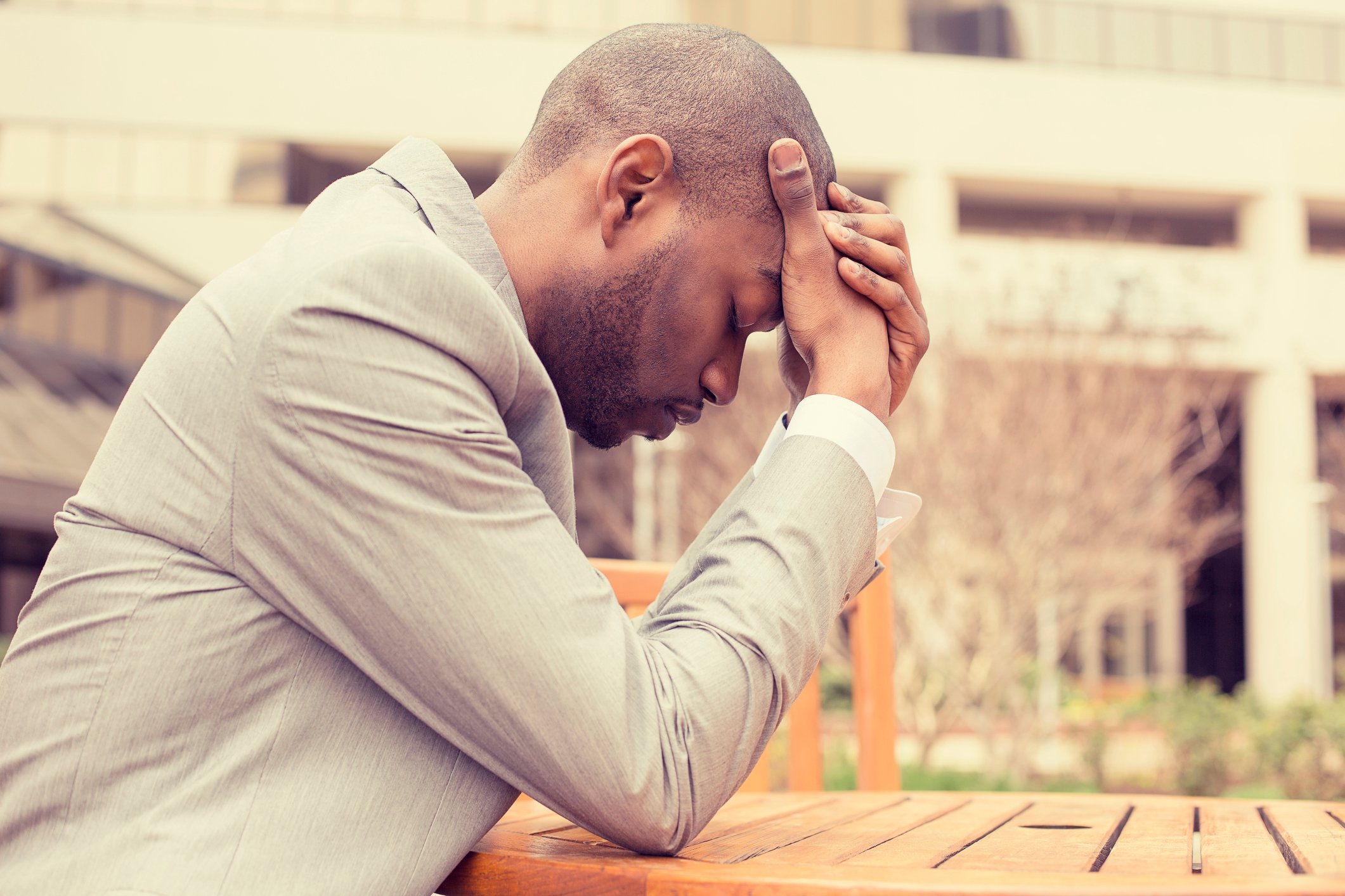 Man holding his head as if stressed