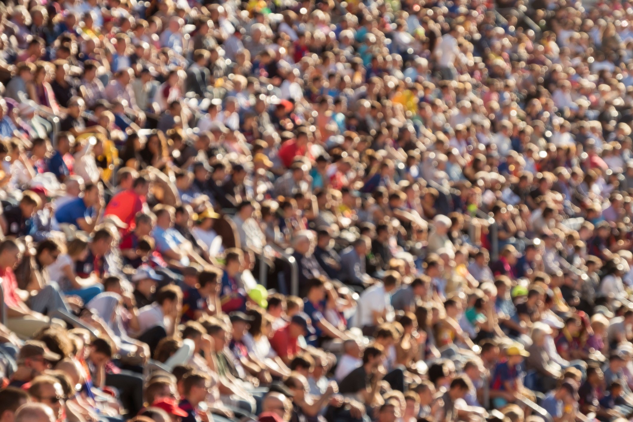 A blurred crowd in a sports stadium
