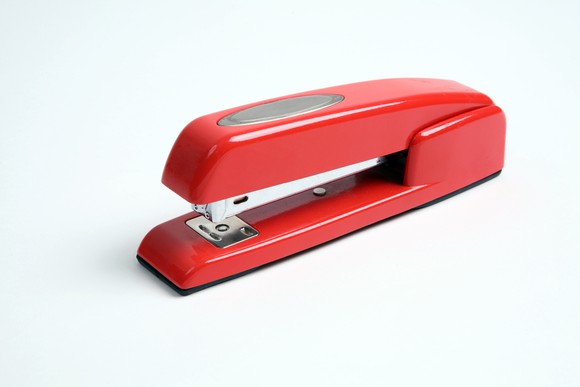 Red stapler in the style of ACCO's Swingline brand.
