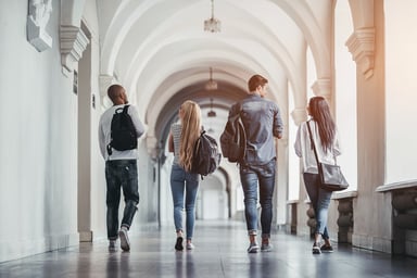 Students Walking In a University Hallway
