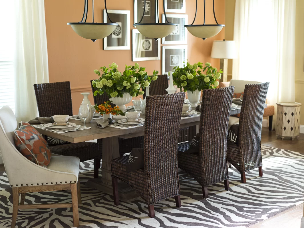 A dining room set with a table and six chairs.