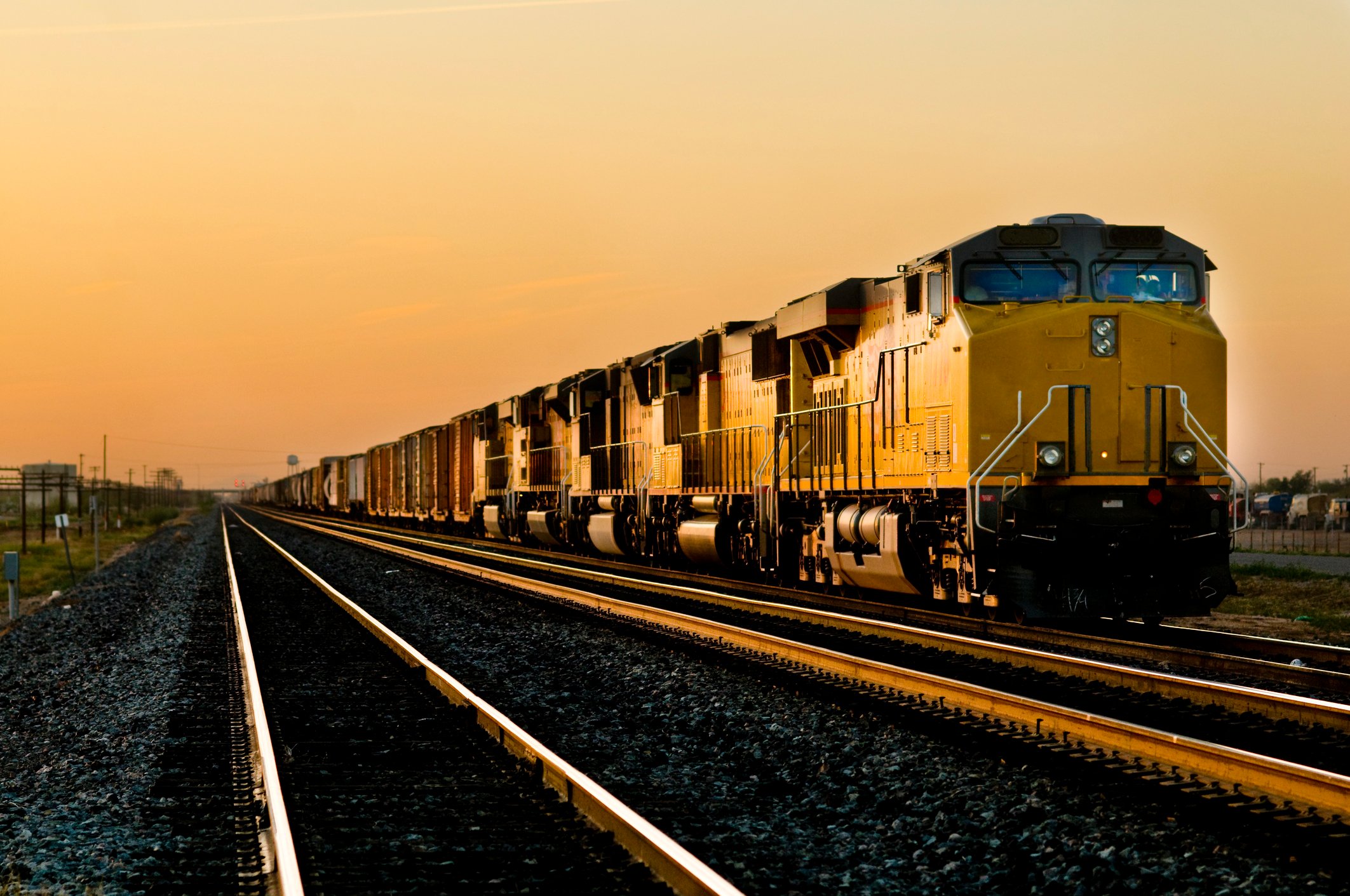 A freight train running next to several empty tracks