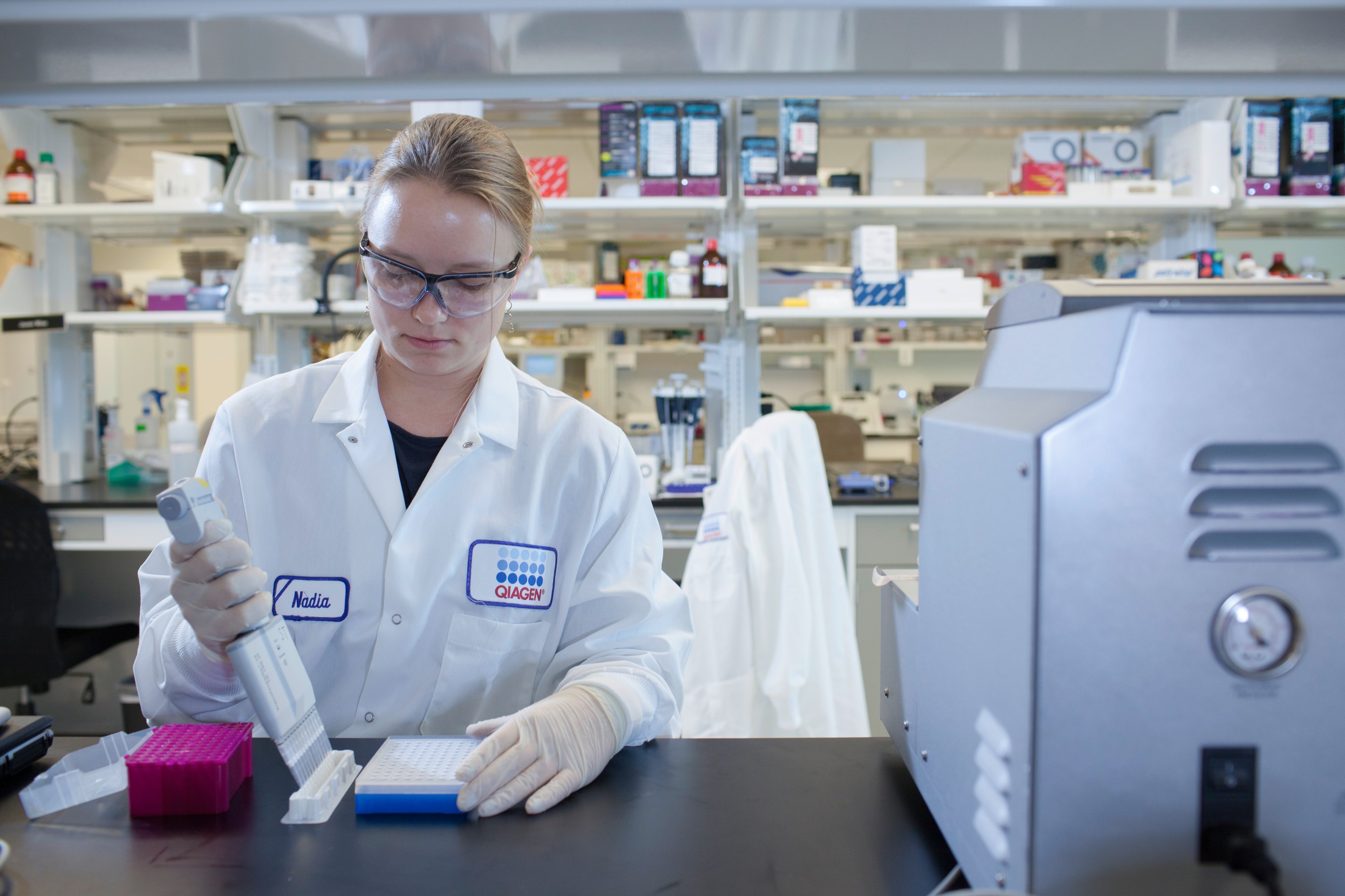 Scientist in a lab using a multi-channel pipette