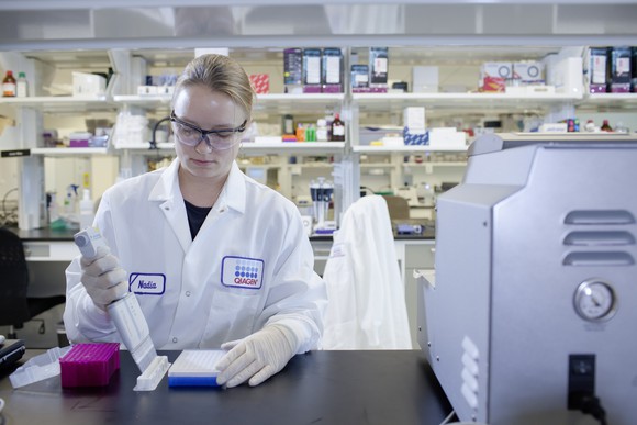 Scientist in a lab using a multi-channel pipette