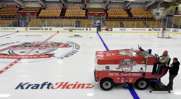 Hockey rink with KraftHeinz branding on floor and walls, with zamboni on the ice.
