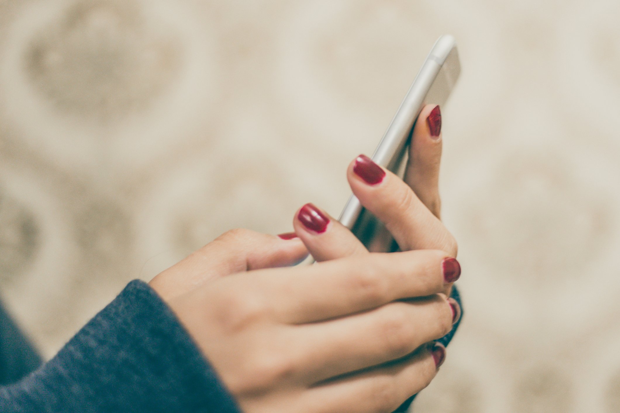 A woman using a mobile phone.