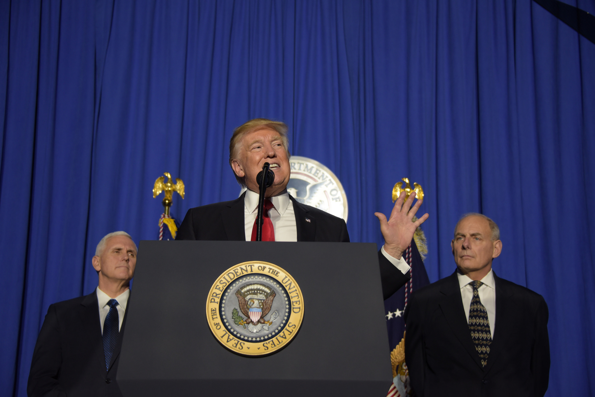 President Trump addressing employees of the Department of Homeland Security from behind the presidential podium.