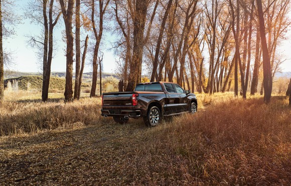 2019 Silverado High Country offroad surrounded by trees.