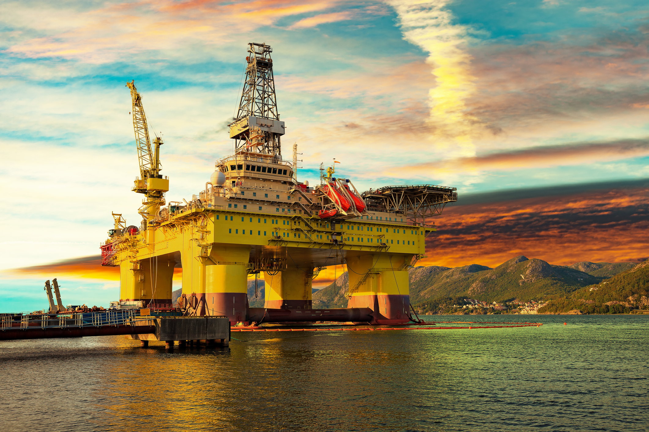 Offshore oil rig at sunset.