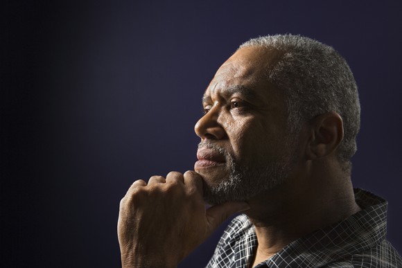 Senior man with hand on chin thinking