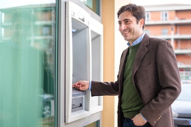 Man Using ATM in Italy