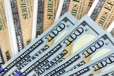 Treasury Bonds With Hundred Dollar Bills Getty