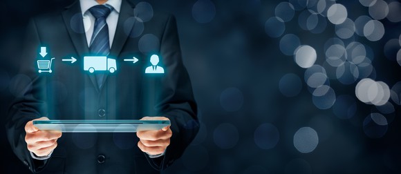 An illustration of a logistics chain on a tablet.