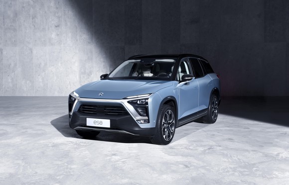 The NIO ES8 SUV in light blue with a black top and black front grille.