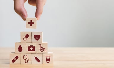 Healthcare icons on wood blocks