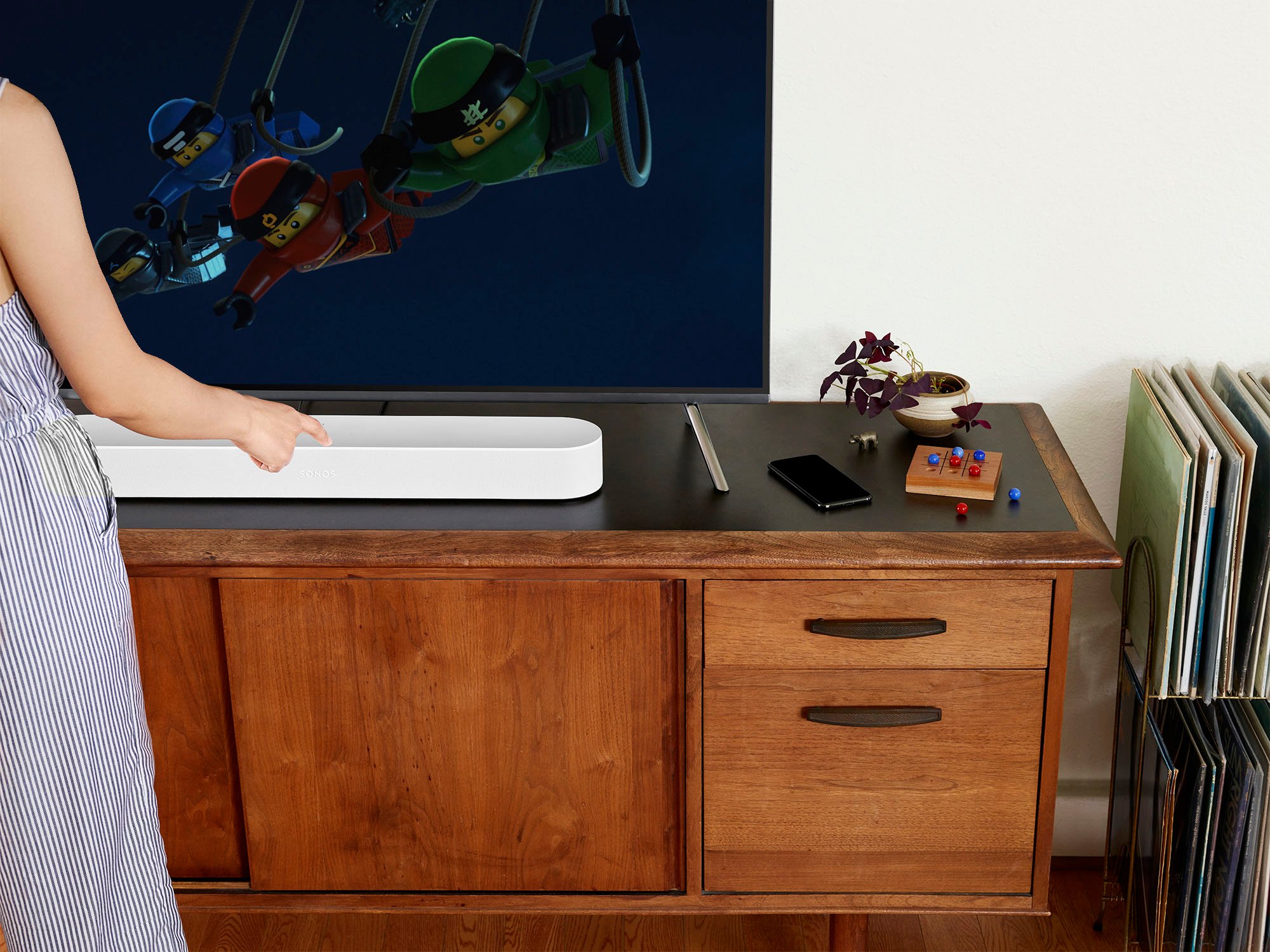 The Sonos Beam in front of a TV.
