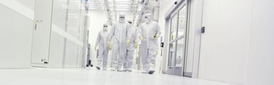 Guys in  white protective suits applied materials