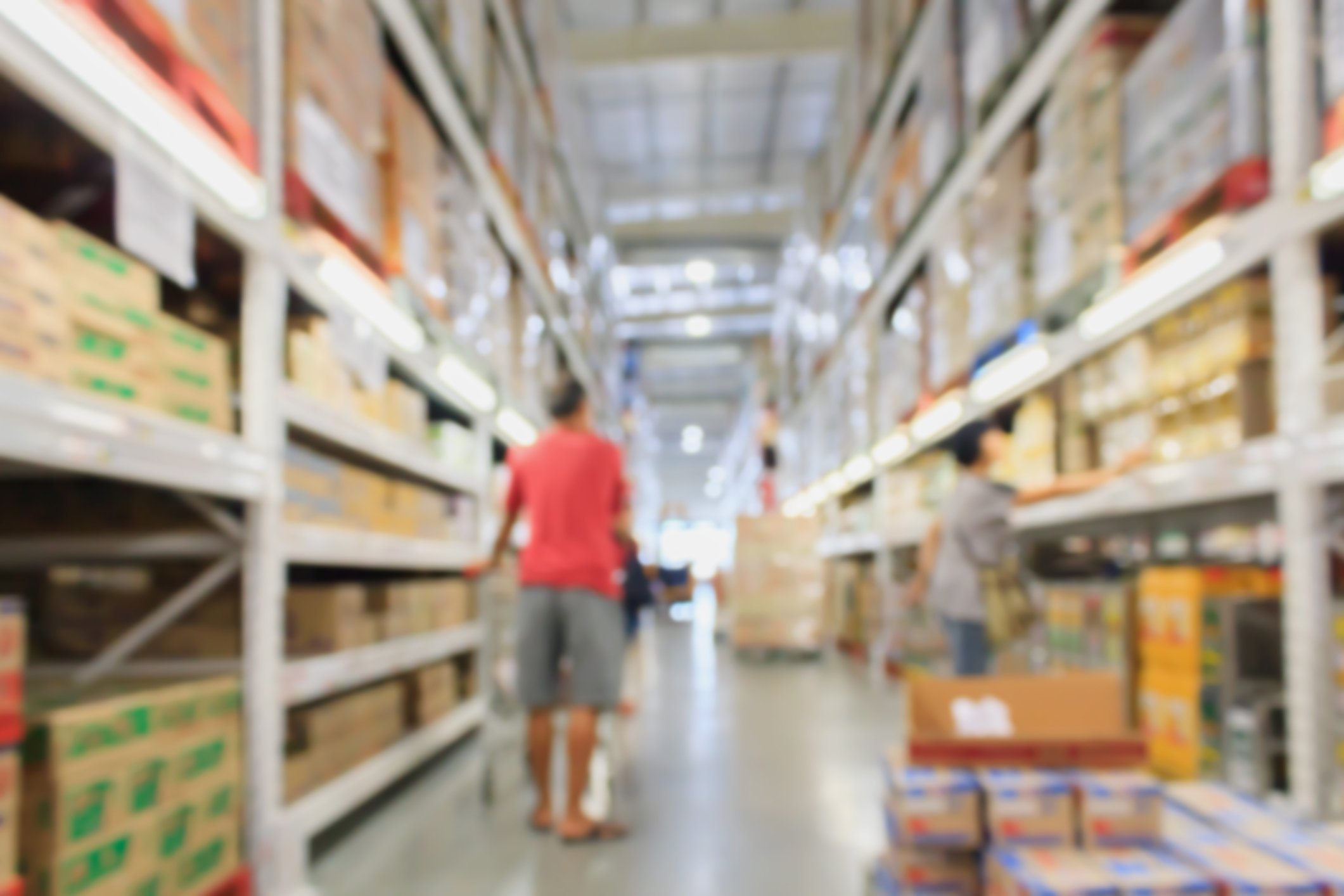 A person shops in a warehouse.