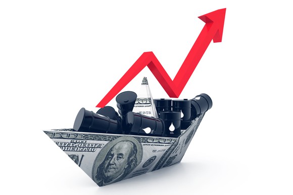 A boat made of $100 bills with tiny barrels of petroleum inside.